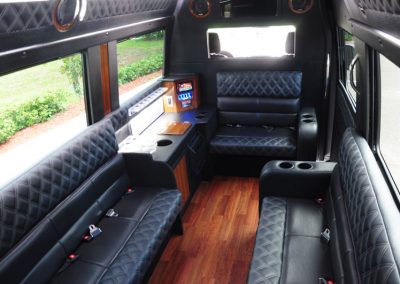 The interior of a limo shuttle, showcasing its spacious and luxurious design